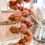 fresh eggs in a spiral egg rack on counter