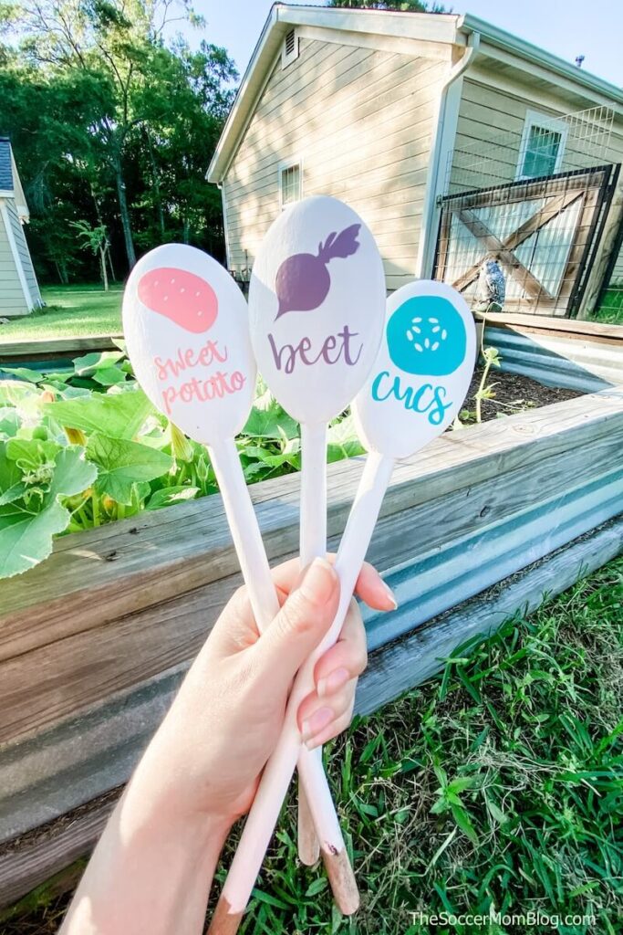 garden markers made with wooden spoons and Cricut cutouts